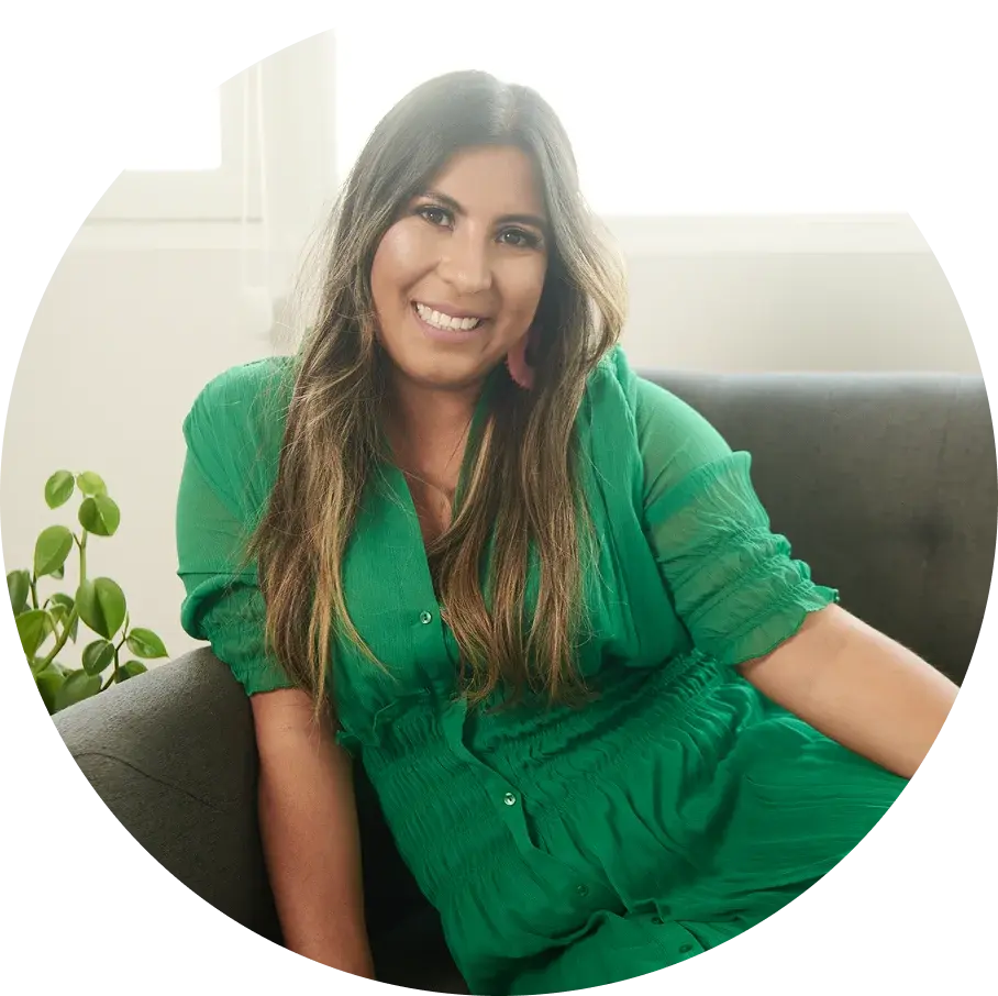 Ayleen Ponce, immigration attorney and founder of The Expat Ally, smiling in professional attire